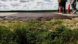 A slurry leveling job performed by Denco leaves a road level again.