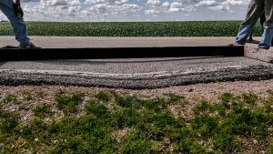 A depression in a road prior to slurry leveling.