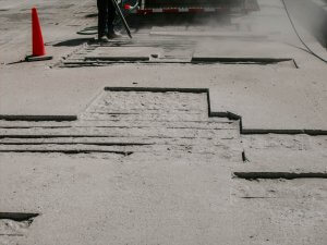 Sections of a bridge deck are exposed for repair.